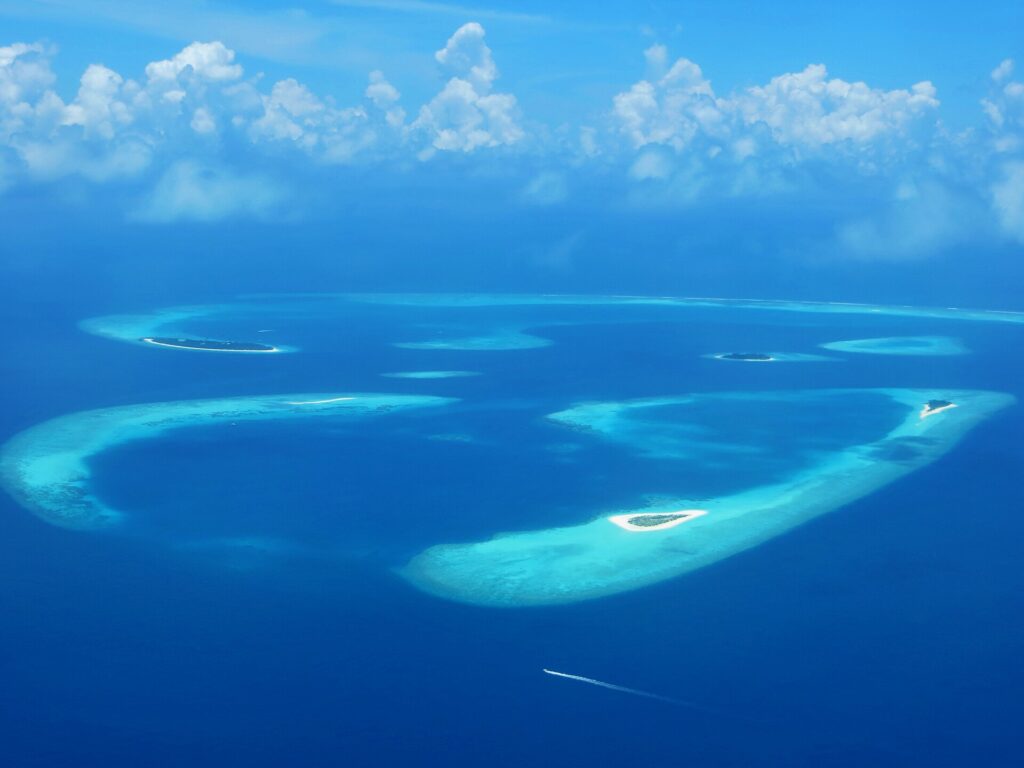 Aerial view of reef-fringed islands and lagoons in Baa Atoll, Maldives