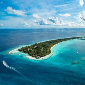 Aerial view of Kuramathi island, home of Niva Kuramathi Maldives, and its lagoon