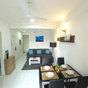 Open-plan living and dining area in an apartment at Urban Stays by Empress